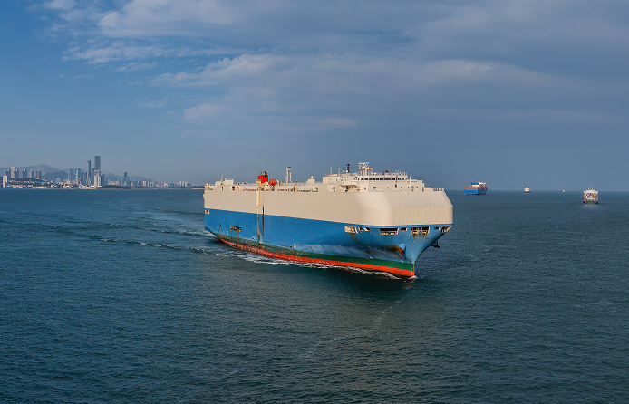 Large cargo ship sailing in open sea.